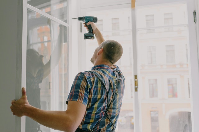 Photo by Ksenia Chernaya: https://www.pexels.com/photo/handyman-installing-window-frame-with-drill-in-house-5691544/