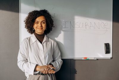 Photo by Mikhail Nilov: https://www.pexels.com/photo/woman-standing-near-a-white-board-8297425/