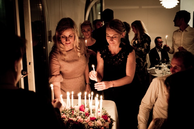 Photo by Rene Asmussen: https://www.pexels.com/photo/two-women-holding-candles-1405528/