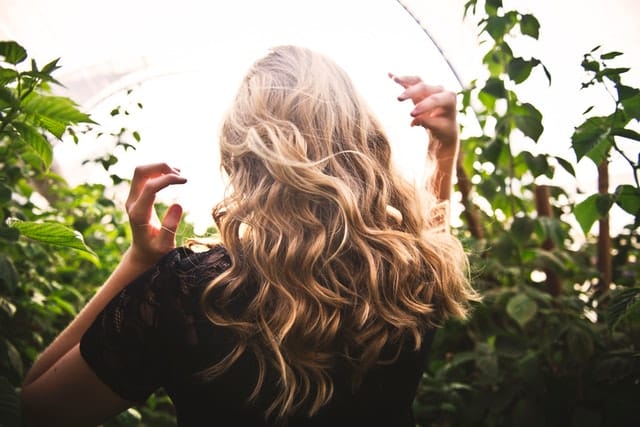 Photo by Tim Mossholder: https://www.pexels.com/photo/blonde-haired-woman-standing-between-green-plants-1049687/