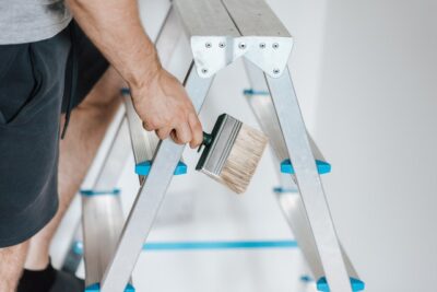 Photo by Anete Lusina: https://www.pexels.com/photo/painter-with-brush-climbing-ladder-during-renovation-work-4792523/