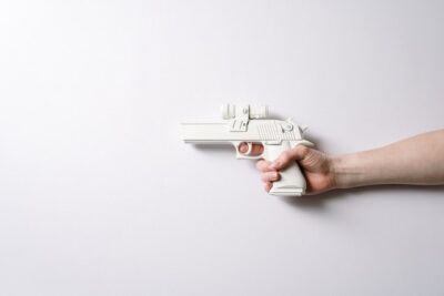 Photo by cottonbro: https://www.pexels.com/photo/person-holding-white-and-gray-toy-gun-3926748/
