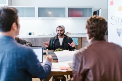 Photo by RODNAE Productions: https://www.pexels.com/photo/photo-of-men-discussing-7413842/