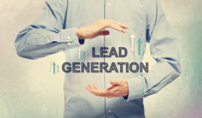 Adobe Stock royalty-free image #91080258, 'Young man in blue shirt holding Lead Generation' uploaded by Tierney, standard license purchased from https://stock.adobe.com/images/download/91080258; file retrieved on February 26th, 2019. License details available at https://stock.adobe.com/license-terms - image is licensed under the Adobe Stock Standard License