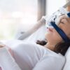 Adobe Stock royalty-free image #177299819, 'Woman and cpap mask, healthcare concept.Senior woman using cpap machine to stop choking and snoring from obstructive sleep apnea with bokeh and morning light background..' uploaded by sbw19, standard license purchased from https://stock.adobe.com/images/download/177299819; file retrieved on June 13th, 2019. License details available at https://stock.adobe.com/license-terms - image is licensed under the Adobe Stock Standard License