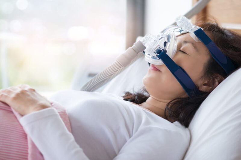 Adobe Stock royalty-free image #177299819, 'Woman and cpap mask, healthcare concept.Senior woman using cpap machine to stop choking and snoring from obstructive sleep apnea with bokeh and morning light background..' uploaded by sbw19, standard license purchased from https://stock.adobe.com/images/download/177299819; file retrieved on June 13th, 2019. License details available at https://stock.adobe.com/license-terms - image is licensed under the Adobe Stock Standard License