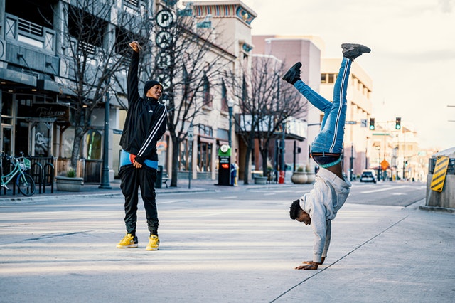Photo by Brett Sayles: https://www.pexels.com/photo/male-friends-doing-breakdance-in-center-of-street-4012667/
