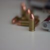 Photo by Enrico Hänel: https://www.pexels.com/photo/close-up-of-bullet-beside-a-gun-5462023/