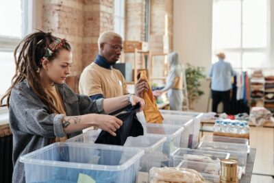 Photo by Julia M Cameron: https://www.pexels.com/photo/woman-with-dreadlocks-sorting-clothes-6994833/