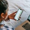 Photo by Liza Summer: https://www.pexels.com/photo/crop-ethnic-analyst-using-trading-application-on-smartphone-on-bed-6347713/