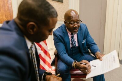 Photo by RODNAE Productions: https://www.pexels.com/photo/men-in-business-suit-looking-at-the-white-paper-with-printed-texts-7841475/