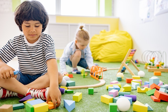 Photo by Yan Krukov: https://www.pexels.com/photo/two-boys-playing-with-wooden-blocks-in-a-room-8612970/