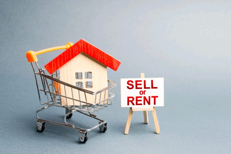 Adobe Stock royalty-free image #289497328, 'House in a shopping cart and a stand with the inscription sell or rent. rental or selling a home. Real estate liquidity, investment and savings. Real estate market, supply and demand, financial bubble' uploaded by ?????? ????????, standard license purchased from https://stock.adobe.com/images/download/289497328; file retrieved on October 12th, 2019. License details available at https://stock.adobe.com/license-terms - image is licensed under the Adobe Stock Standard License
