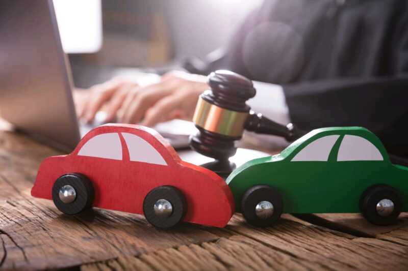 Adobe Stock royalty-free image #195567570, 'Close-up Of Two Green And Red Wooden Cars' uploaded by Andrey Popov, standard license purchased from https://stock.adobe.com/images/download/195567570; file retrieved on January 9th, 2019. License details available at https://stock.adobe.com/license-terms - image is licensed under the Adobe Stock Standard License