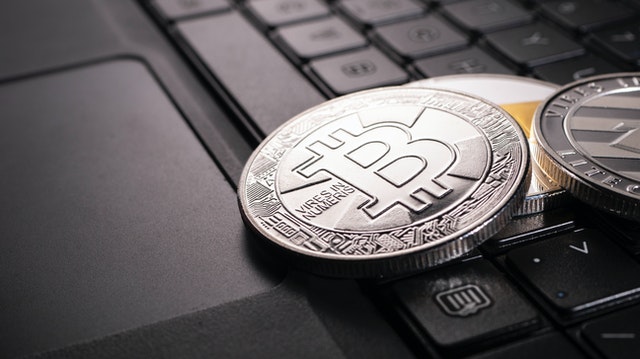 Photo by Jievani: https://www.pexels.com/photo/silver-round-coin-on-black-computer-keyboard-8185628/