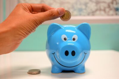 Photo by maitree rimthong: https://www.pexels.com/photo/person-putting-coin-in-a-piggy-bank-1602726/