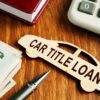 Adobe Stock royalty-free image #294316505, 'Car title loan concept. Wooden model of vehicle and money.' uploaded by designer491, standard license purchased from https://stock.adobe.com/images/download/294316505; file retrieved on October 28th, 2019. License details available at https://stock.adobe.com/license-terms - image is licensed under the Adobe Stock Standard License