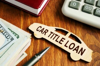 Adobe Stock royalty-free image #294316505, 'Car title loan concept. Wooden model of vehicle and money.' uploaded by designer491, standard license purchased from https://stock.adobe.com/images/download/294316505; file retrieved on October 28th, 2019. License details available at https://stock.adobe.com/license-terms - image is licensed under the Adobe Stock Standard License