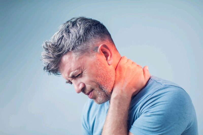 Adobe Stock royalty-free image #203677321, 'Young man suffering from neck pain. Headache pain.' uploaded by Aleksej, standard license purchased from https://stock.adobe.com/images/download/203677321; file retrieved on July 30th, 2019. License details available at https://stock.adobe.com/license-terms - image is licensed under the Adobe Stock Standard License