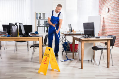 Adobe Stock royalty-free image #164225604, 'Male Janitor Cleaning Floor With Mop' uploaded by Andrey Popov
