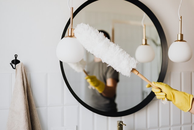 Photo by Karolina Grabowska: https://www.pexels.com/photo/crop-woman-dusting-lamp-during-housework-4239031/