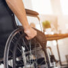 Adobe Stock royalty-free image #181562109, 'A disabled man is sitting in a wheelchair.' uploaded by VadimGuzhva, standard license purchased from https://stock.adobe.com/images/download/181562109; file retrieved on October 16th, 2019. License details available at https://stock.adobe.com/license-terms - image is licensed under the Adobe Stock Standard License