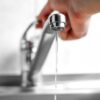 Adobe Stock royalty-free image #255702011, 'Hand opens the water tap. Close up' uploaded by OBprod, standard license purchased from https://stock.adobe.com/images/download/255702011; file retrieved on September 1st, 2019. License details available at https://stock.adobe.com/license-terms - image is licensed under the Adobe Stock Standard License