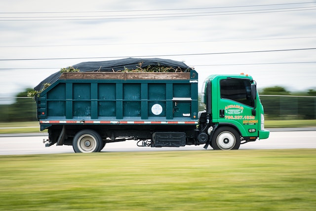 Photo by Alfred GF: https://www.pexels.com/photo/side-view-of-a-green-truck-11521609/