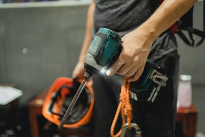 Photo by Allan Mas: https://www.pexels.com/photo/crop-repairman-standing-with-working-screwdriver-and-orange-helmet-5383809/