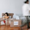 Photo by Blue Bird: https://www.pexels.com/photo/woman-sitting-on-floor-beside-packed-boxes-7218512/