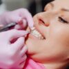 Photo by Karolina Grabowska: https://www.pexels.com/photo/a-dentist-applying-a-veneer-tooth-on-a-patient-6627571/
