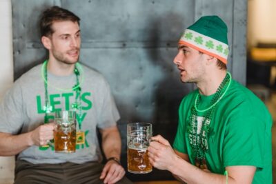 Photo by Laura Tancredi: https://www.pexels.com/photo/two-men-drinking-beers-during-saint-patrick-s-day-7084036/