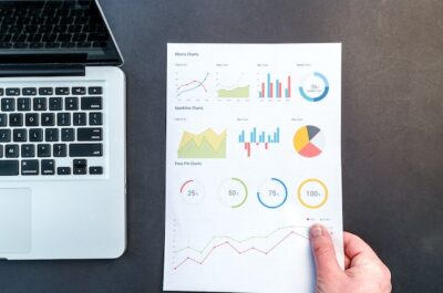 Photo by Lukas: https://www.pexels.com/photo/person-holding-chart-and-bar-graph-669612/