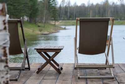 Photo by Maria Tsegelnik: https://www.pexels.com/photo/brown-wooden-folding-chair-and-table-near-body-of-water-12236090/