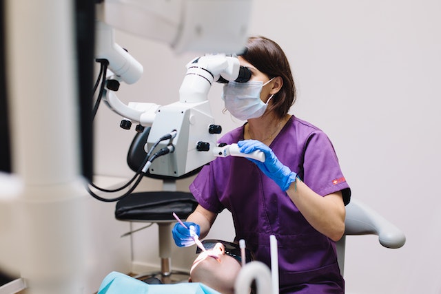 Photo by Polina Zimmerman: https://www.pexels.com/photo/woman-in-purple-scrub-using-a-dental-equipment-in-examining-a-patient-4687360/