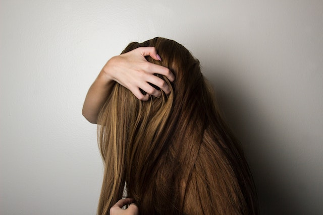 Photo by Bennie Lukas Bester: https://www.pexels.com/photo/photo-of-woman-covering-face-with-her-hair-1159334/