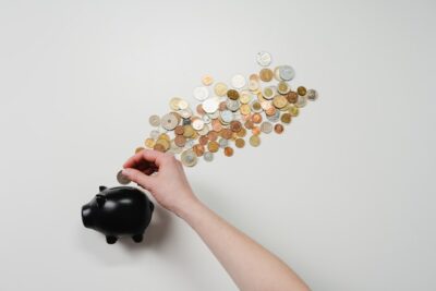 Photo by cottonbro: https://www.pexels.com/photo/person-putting-coin-in-a-piggy-bank-3943716/