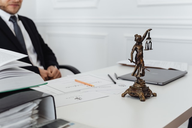 Photo by Karolina Grabowska: https://www.pexels.com/photo/a-lawyer-behind-his-desk-7876093/