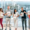 Photo by Kindel Media: https://www.pexels.com/photo/a-group-of-people-holding-papers-with-printed-taxes-7688519/