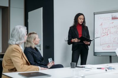 Photo by Pavel Danilyuk: https://www.pexels.com/photo/a-woman-in-a-meeting-with-her-colleagues-8424570/