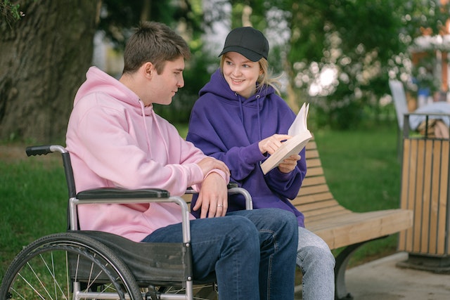 Photo by SHVETS production: https://www.pexels.com/photo/a-couple-reading-a-book-at-the-park-8415833/
