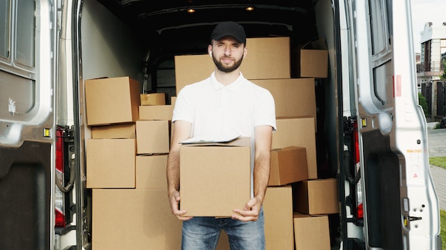 Photo by Artem Podrez: https://www.pexels.com/photo/man-smiling-while-holding-a-box-5025638/