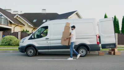 Photo by Artem Podrez: https://www.pexels.com/photo/man-carrying-boxes-beside-a-van-5025669/