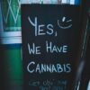 Photo by Erik Mclean: https://www.pexels.com/photo/board-with-cannabis-offer-near-wall-of-building-4173868/