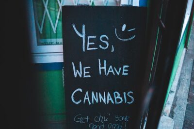 Photo by Erik Mclean: https://www.pexels.com/photo/board-with-cannabis-offer-near-wall-of-building-4173868/