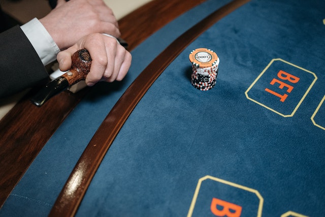 Photo by Pavel Danilyuk: https://www.pexels.com/photo/a-person-holding-a-pipe-near-the-gaming-table-7594266/