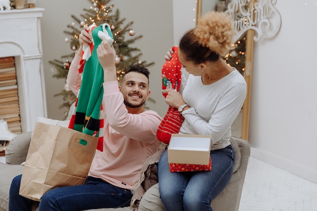 Photo by Thirdman: https://www.pexels.com/photo/a-couple-opening-christmas-presents-6533915/