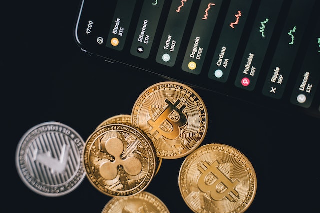 Photo by Alesia Kozik: https://www.pexels.com/photo/bitcoins-beside-a-phone-6771664/