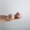 Photo by cottonbro studio: https://www.pexels.com/photo/a-person-holding-beige-and-pink-knitted-breast-5701083/