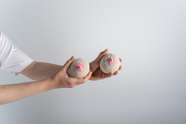 Photo by cottonbro studio: https://www.pexels.com/photo/a-person-holding-beige-and-pink-knitted-breast-5701083/